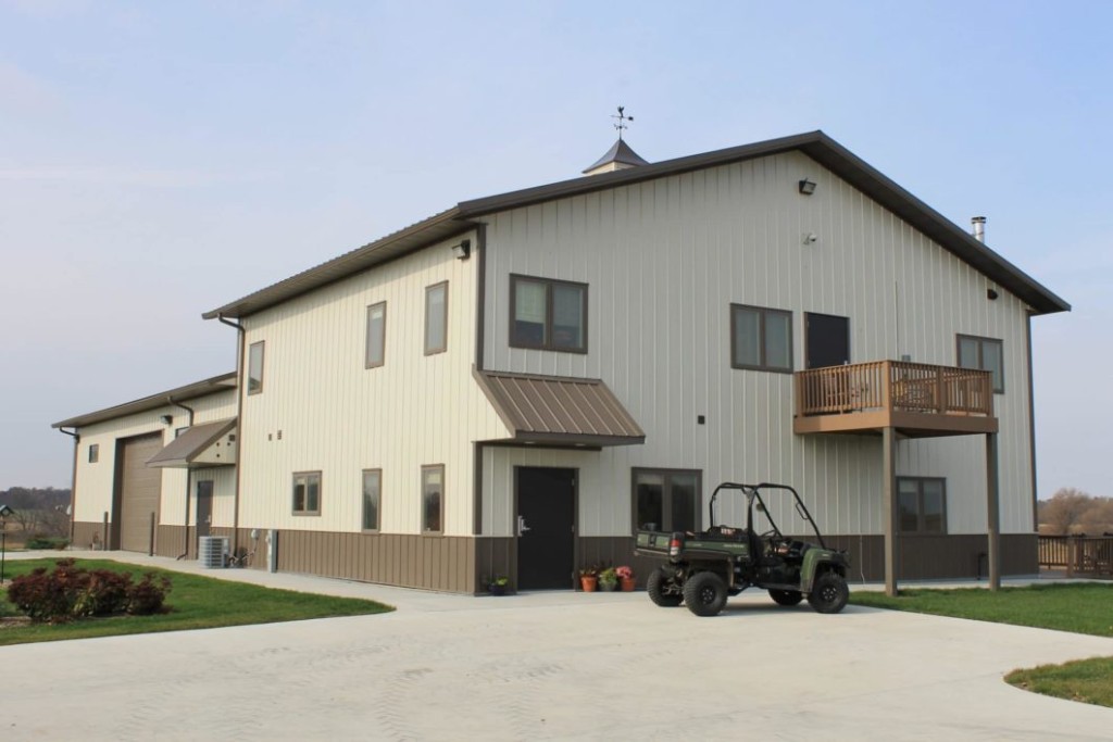 Decks Post-frame building with an exterior deck and elevated outdoor access.