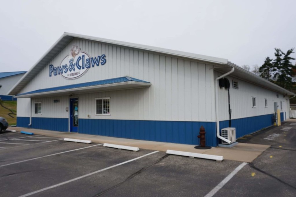 Eyebrow Overhang Post-frame commercial building with an eyebrow overhang above the front entrance.