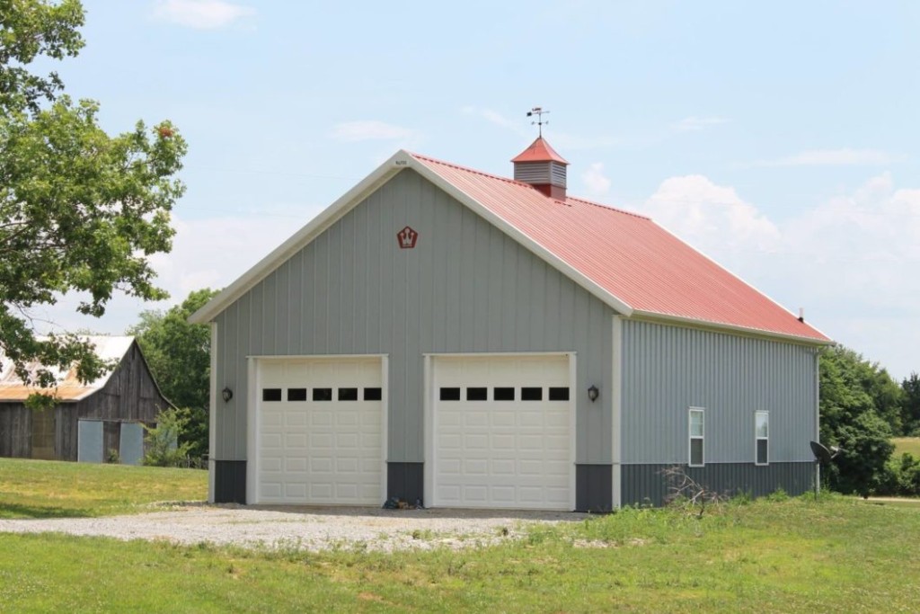 Overhead Doors Post-frame garage with multiple overhead doors for vehicle and equipment access.