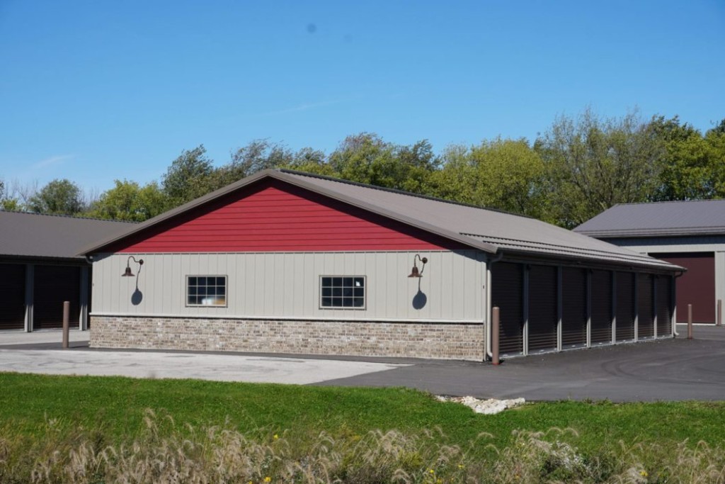 Snow Guards Post-frame building with snow guards installed along the metal roof.