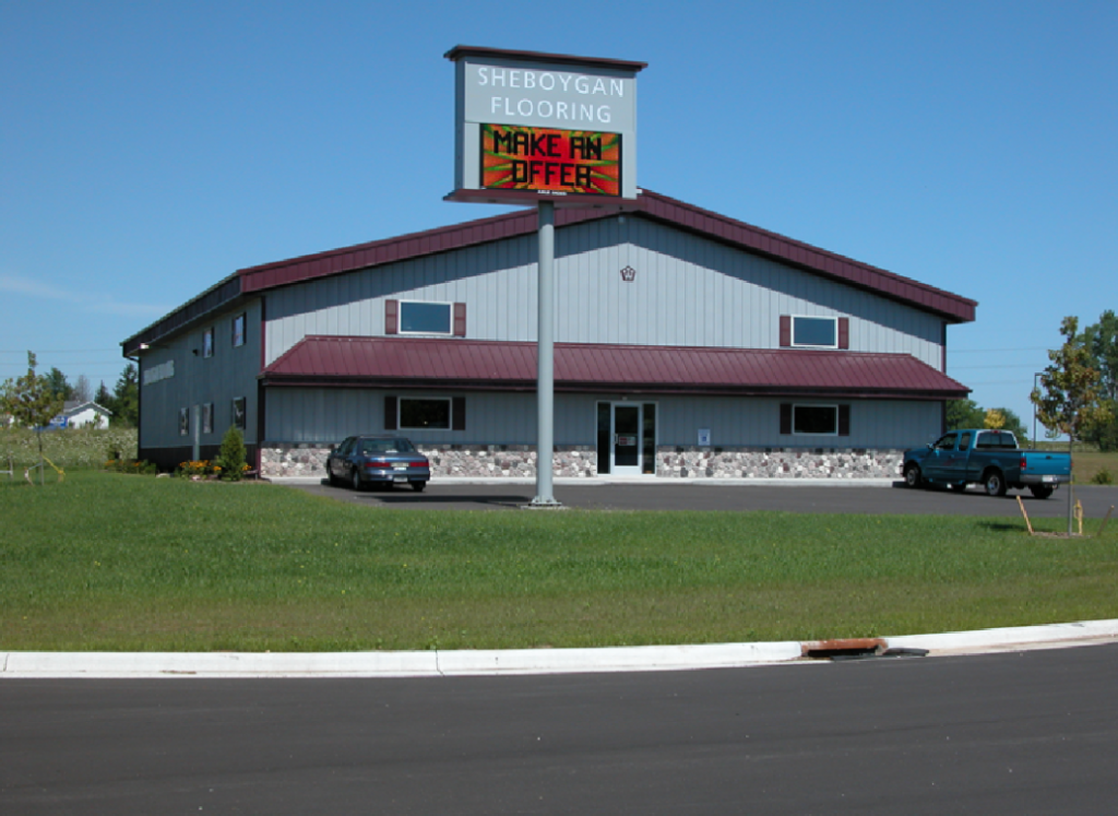 Two-Story Post-Frame Building Two-story post-frame building with metal siding, large overhead doors, and a raised upper level.