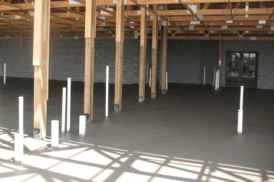 Pole Barn Foundation Designs Pole barn foundation design with concrete pad and interior support posts.
