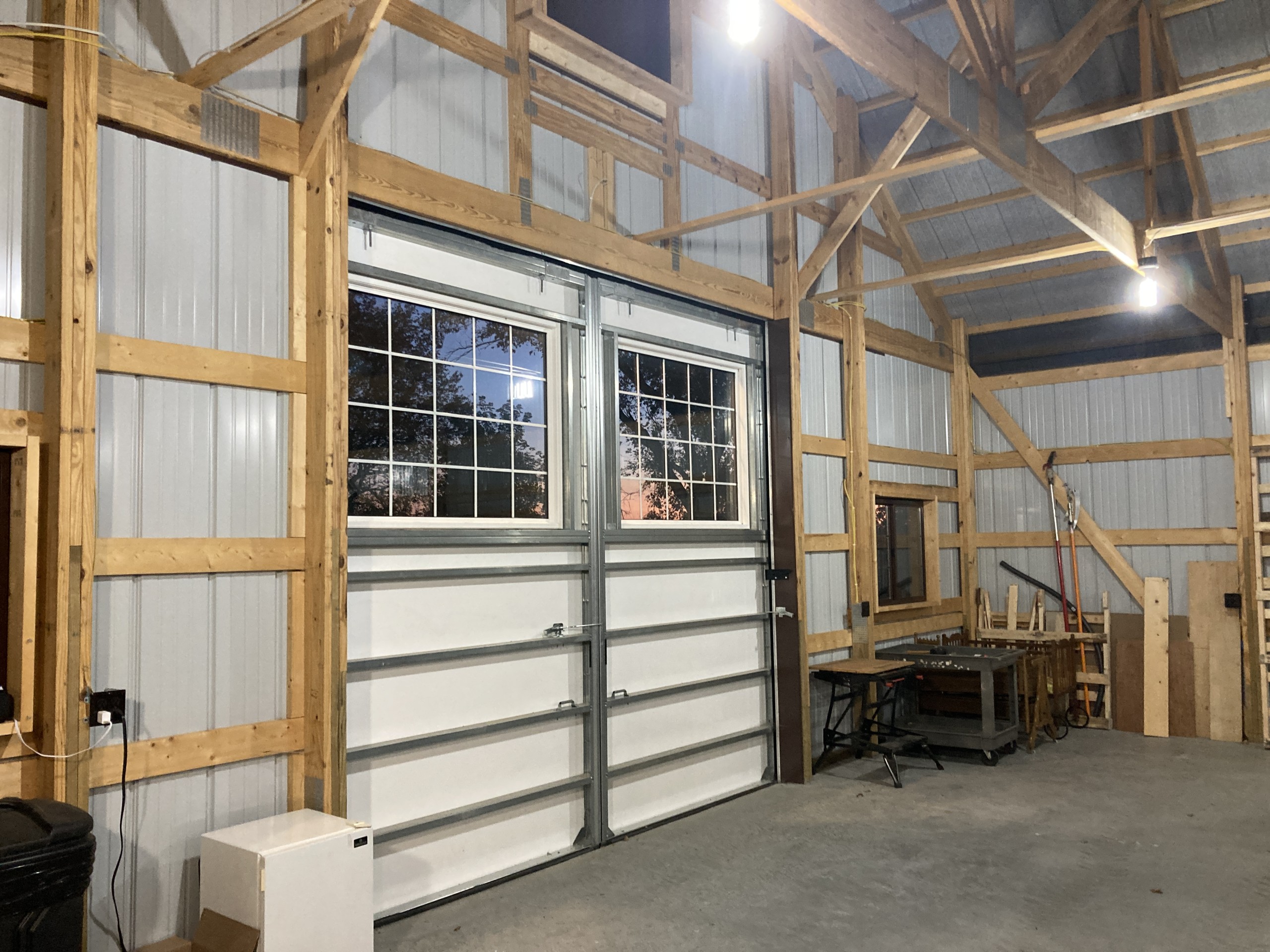 Interior view of the 13′ × 11′4″ Touch of Class sliding door in a custom machinery storage building