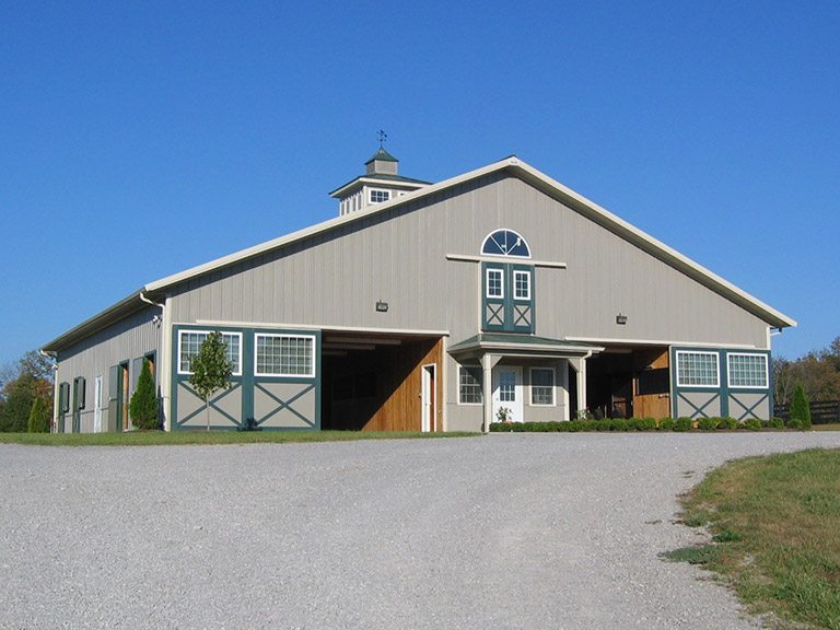 Custom Equestrian Facility and Horse Barn | Walters Buildings Custom equestrian facility with horse stalls, natural lighting, and ventilation designed for horse care and training