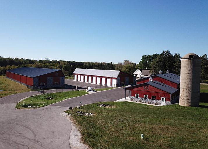 Post-frame commercial storage building development with multiple units, steel siding, and large-scale layout