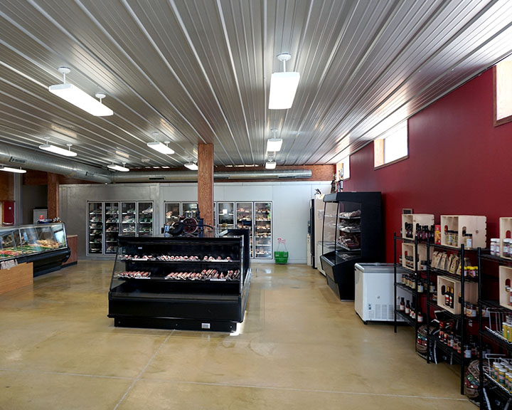 Retail store interior with open floor plan, display cases, and organized product layout