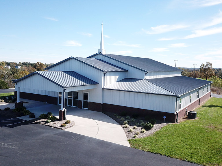 Church Building with Covered Entry and Steeple | Walters Buildings Church building with steel siding, covered entrance, and steeple for community gatherings