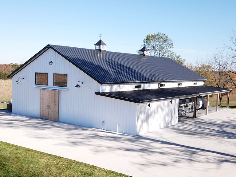 Community Event Building with Covered Gathering Space | Walters Buildings Community event building with steel siding, cupolas, and covered outdoor gathering area