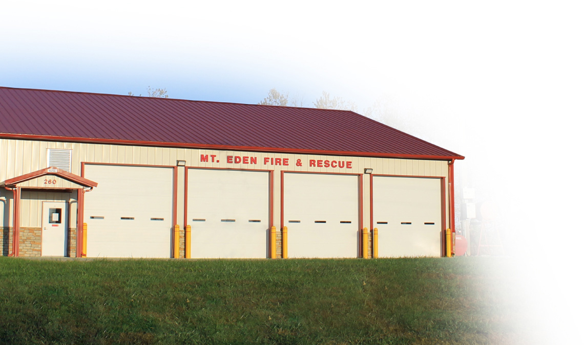 Fire Station with Multiple Apparatus Bays and Overhead Doors | Walters Buildings Fire station building with steel siding, multiple overhead doors, and emergency vehicle bays