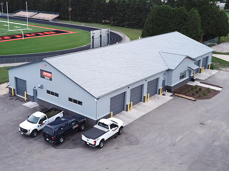 Community Service Building with Overhead Doors and Office Area | Walters Buildings Community service building with steel siding, overhead doors, and attached office space