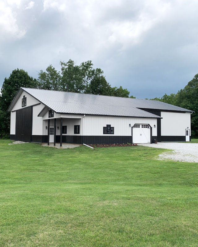 Equipment Storage Building with Sliding Door and Porch | Walters Buildings Equipment storage building with large sliding door, covered porch, and drive-up access