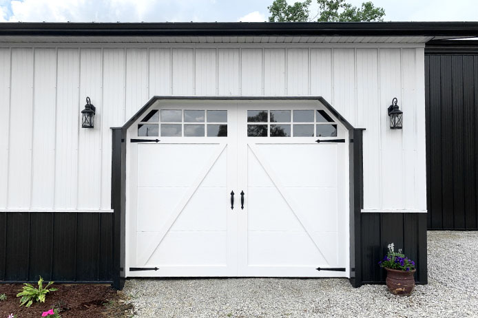 Equipment Storage Building Overhead Door Detail | Walters Buildings Equipment storage building overhead door with window panels and decorative hardware
