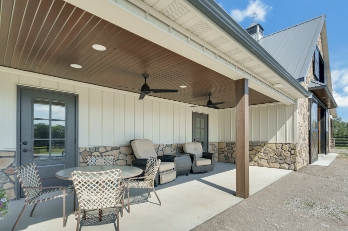 Horse Barn Covered Patio | Walters Buildings Horse barn covered patio with seating and ceiling fans