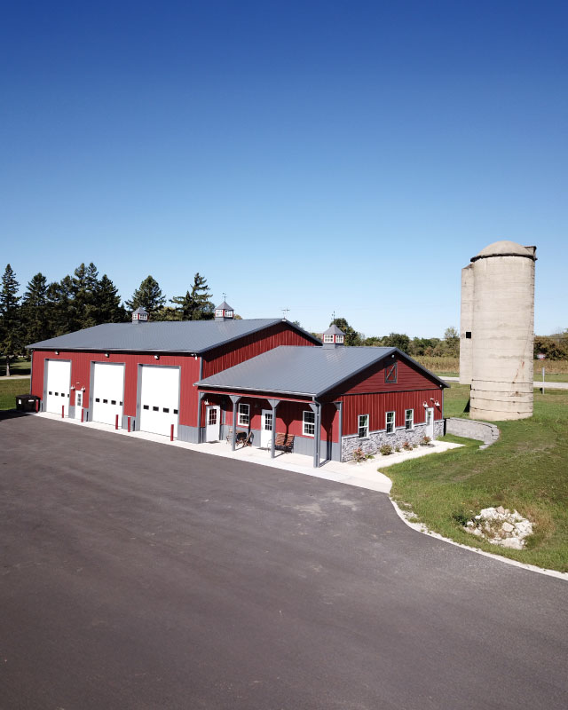 Modern Storage Facility in Waukesha Wisconsin | Lone Silo Storage Buildings Lone Silo Storage facility in Waukesha Wisconsin featuring red post frame storage buildings with gray metal roofs and multiple storage units.