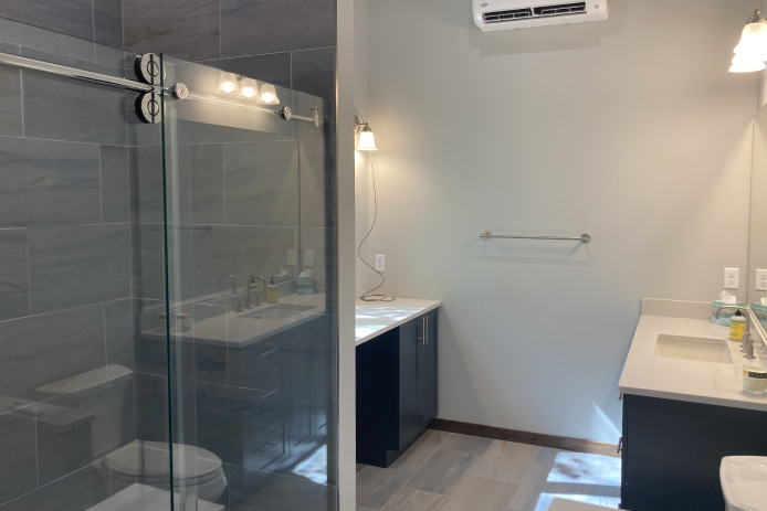 Shop with Living Quarters Bathroom with Glass Shower | Walters Buildings Shop with living quarters bathroom with glass shower, vanity, and finished interior