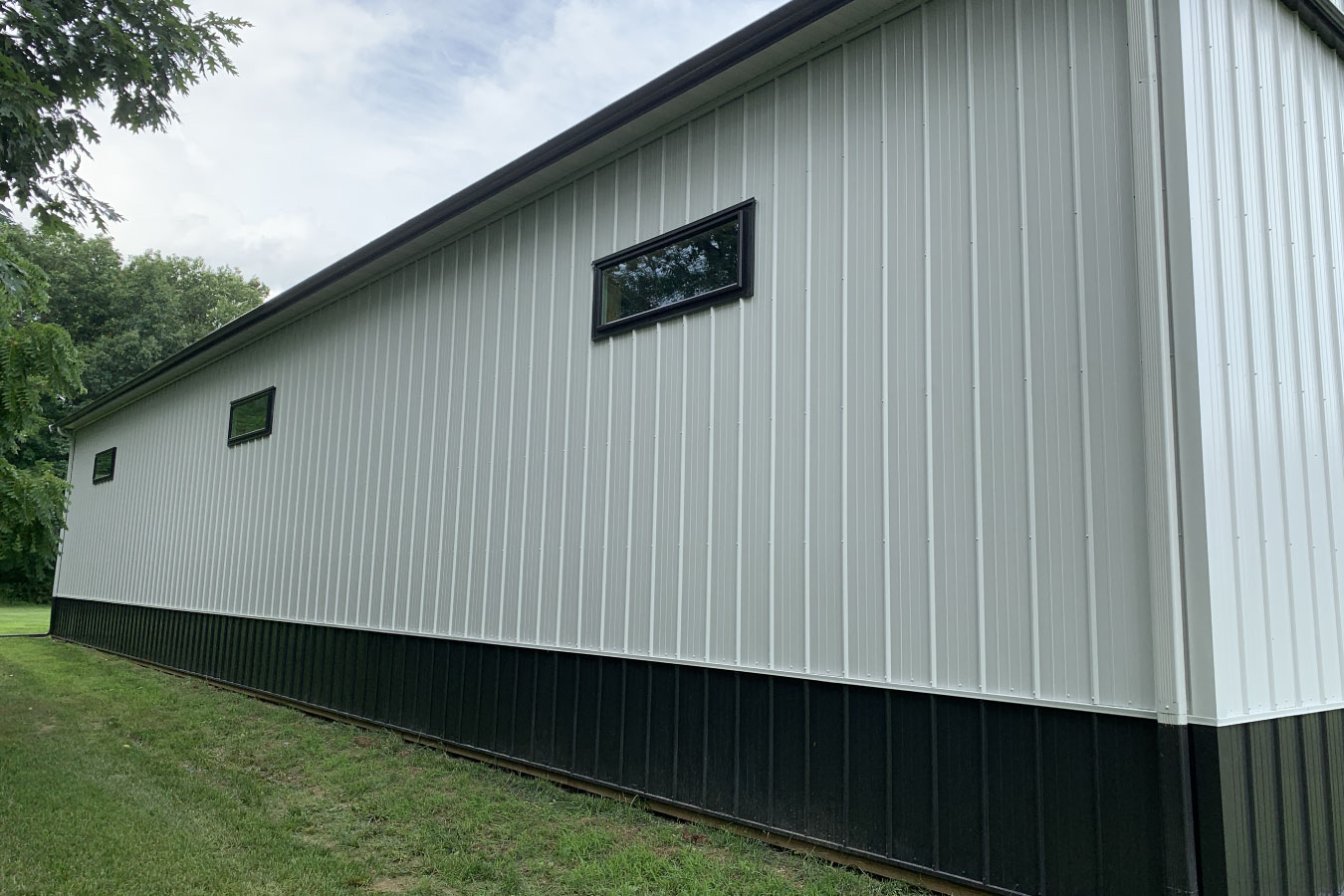 Equipment storage building side elevation with upper windows and extended wall length