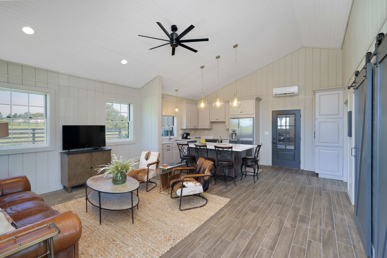 Horse barn living quarters with open kitchen and lounge area