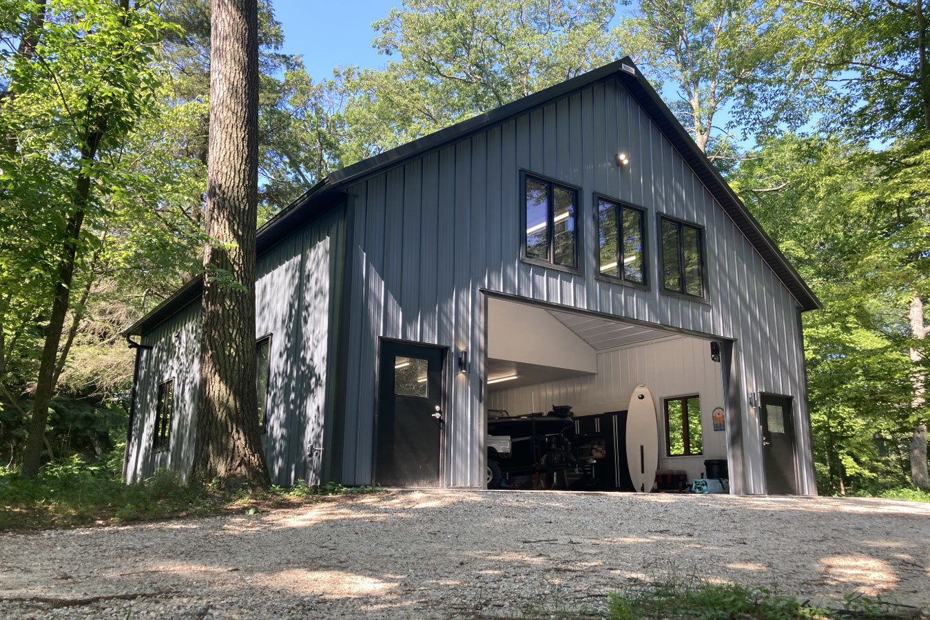 95-1603 Shop with living quarters metal building with large garage door and upper-level living space