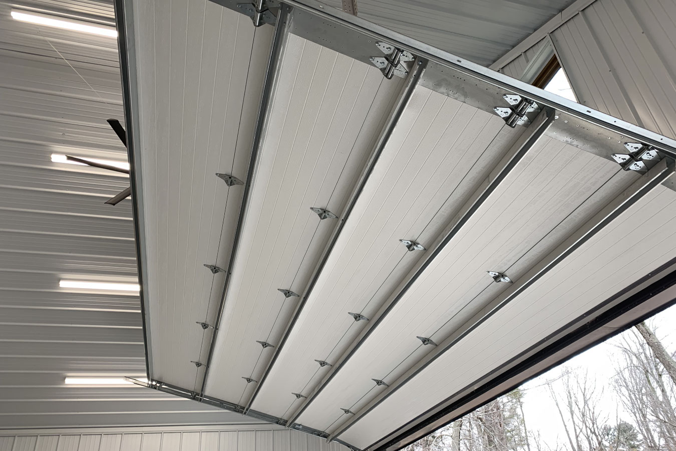 Shop with living quarters insulated overhead garage door with steel track system