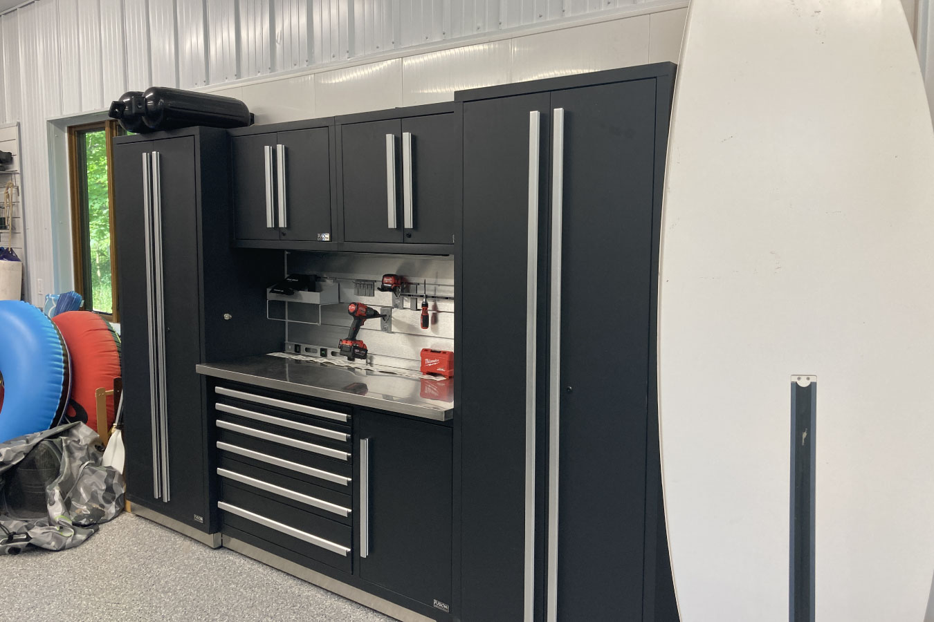 Shop with living quarters workshop storage cabinets and workbench with organized tool setup