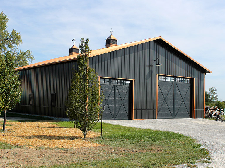Post-Frame Storage Building with Large Sliding Doors and Cupolas Post-frame storage building with steel siding, large sliding doors, cupolas, and equipment access