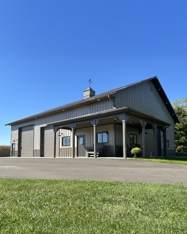 Ultimate Man Cave Garage with Covered Porch | Walters Buildings Custom man cave garage with steel siding, covered porch, and overhead doors
