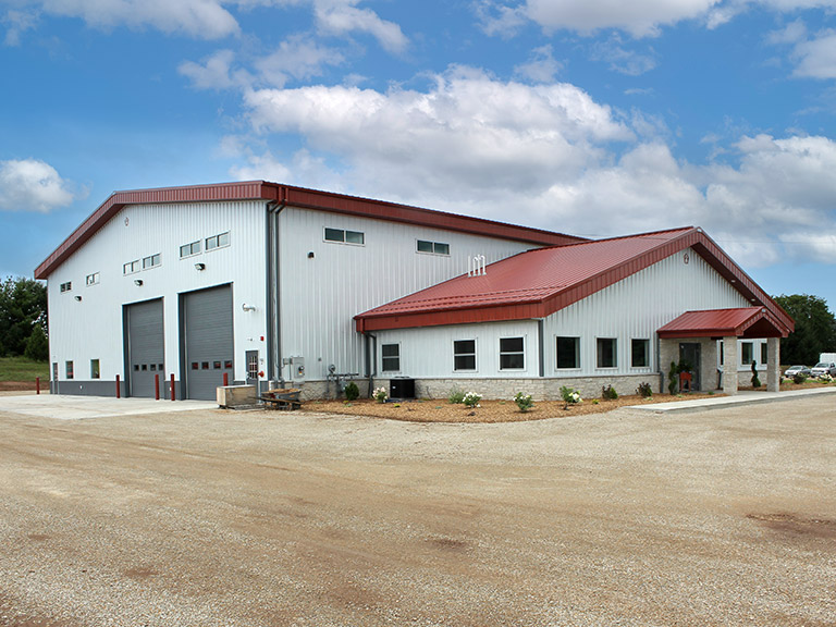 Custom Commercial Steel Building with Shop and Office Space | Walters Buildings Custom commercial steel building with overhead doors and office space designed for shop and business use