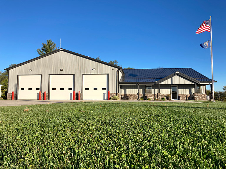 Custom Commercial Service Facility Building | Walters Buildings Custom commercial steel building with overhead vehicle bays and office space for service facility use