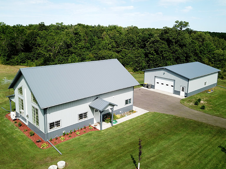 Custom Post Frame Home with Detached Garage | Walters Buildings Custom post-frame home with detached garage building designed for residential living and shop use