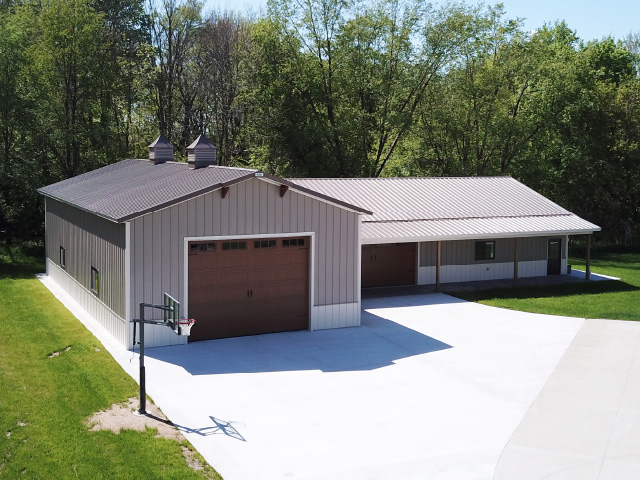 Post Frame Garage with Lean To Addition Designed with Walters 3D Building Designer Post frame garage with steel siding, overhead door, cupolas, and lean to addition designed with Walters 3D building designer