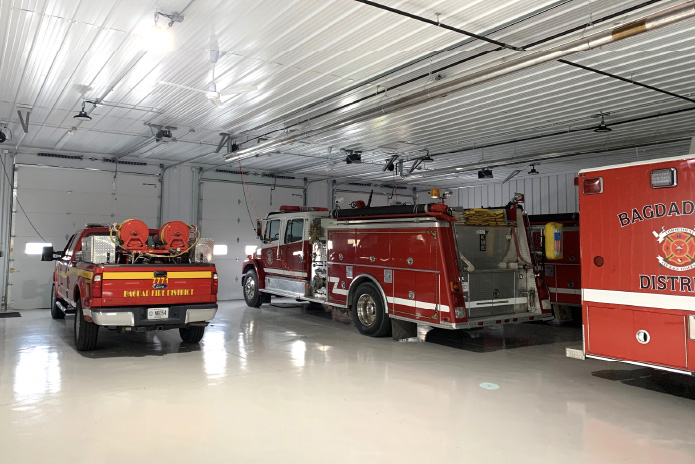 Fire Department Apparatus Bay with Emergency Vehicles Fire department apparatus bay with fire trucks and emergency response vehicles