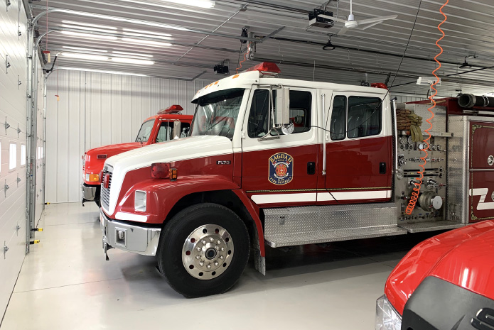 Fire Department Apparatus Bay with Emergency Vehicles Fire department apparatus bay with fire trucks and emergency response vehicles