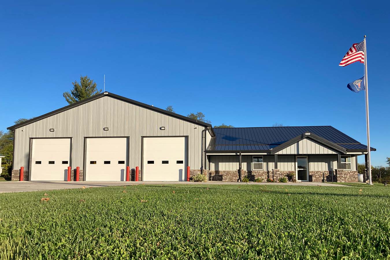 41-3804 Fire department station building with three apparatus bay doors and office entrance