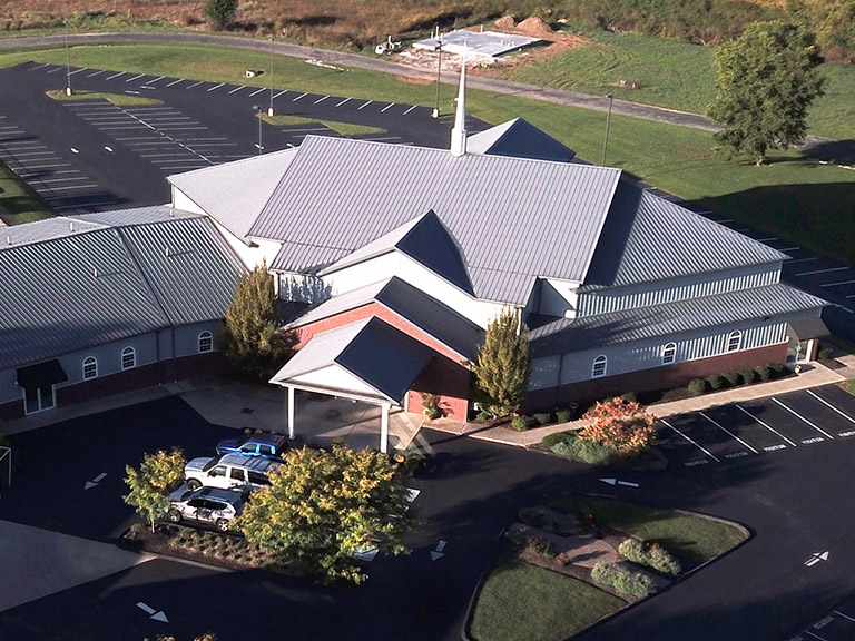 Church Building with Covered Entrance and Steeple | Walters Buildings Church building with steel siding, steeple, and covered entrance for worship and gatherings