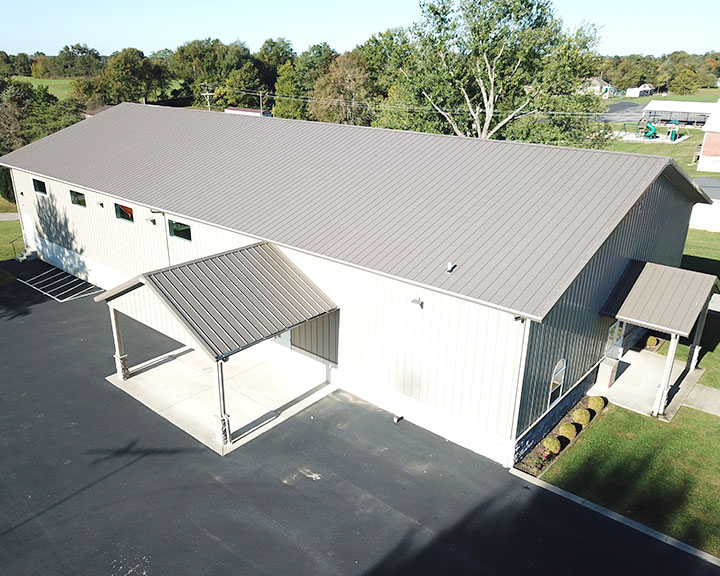 Church building with steel siding, covered entrance, and welcoming design for worship and gatherings