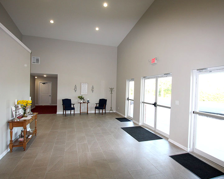 Church lobby interior with open layout, seating area, and welcoming entry space
