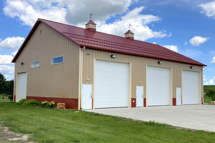 Three Bay Commercial Storage Condo with Overhead Doors | Walters Buildings Commercial storage condo with three overhead doors, walk doors, cupolas, and concrete approach
