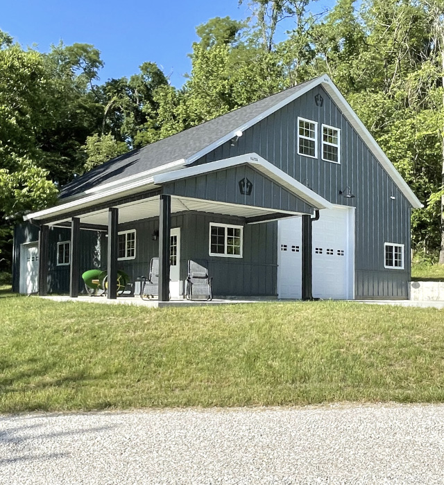 Garage with Living Quarters | Post Frame Building with Covered Porch | Walters Buildings garage with living quarters featuring steel siding, covered porch, and upper-level loft