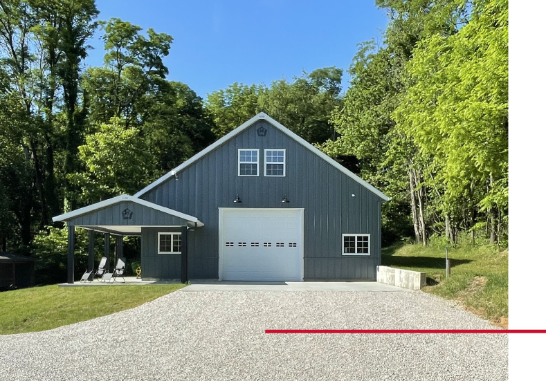 Garage with Living Quarters Front View | Post Frame Building with Covered Porch | Walters Buildings garage with living quarters front view with steel siding, covered porch, and overhead garage door