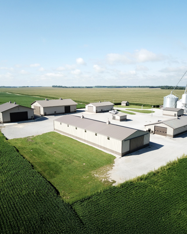 Grain Farm Pole Barns and Agricultural Storage Buildings in Enfield, Illinois Aerial view of multiple grain farm pole barns used as agricultural storage buildings on a Southern Illinois farm in Enfield, Illinois