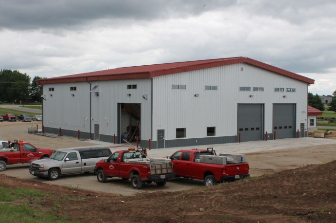 Large Industrial Metal Building – Equipment Service Metal Building large industrial metal building with tall overhead doors for equipment service