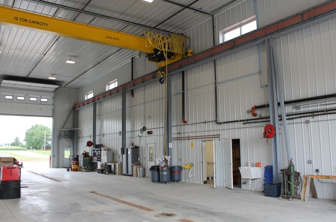 Metal Building Interior with 10-Ton Overhead Crane – Industrial Service Metal Building by Walters Buildings metal building interior with 10 ton overhead crane steel wall panels service bay and high clearance shop
