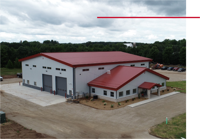 Large Industrial Metal Building with Red Steel Roof and Office Wing – Walters Buildings large industrial metal building with red steel roof white siding overhead service doors and office wing