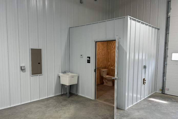 Business Condo Interior with Bathroom and Utility Sink | Walters Buildings business condo interior with bathroom, utility sink, and finished steel walls