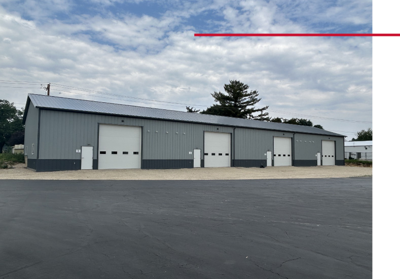 Business Condos Exterior with Multiple Units | Walters Buildings business condos building with multiple units and overhead garage doors on paved lot