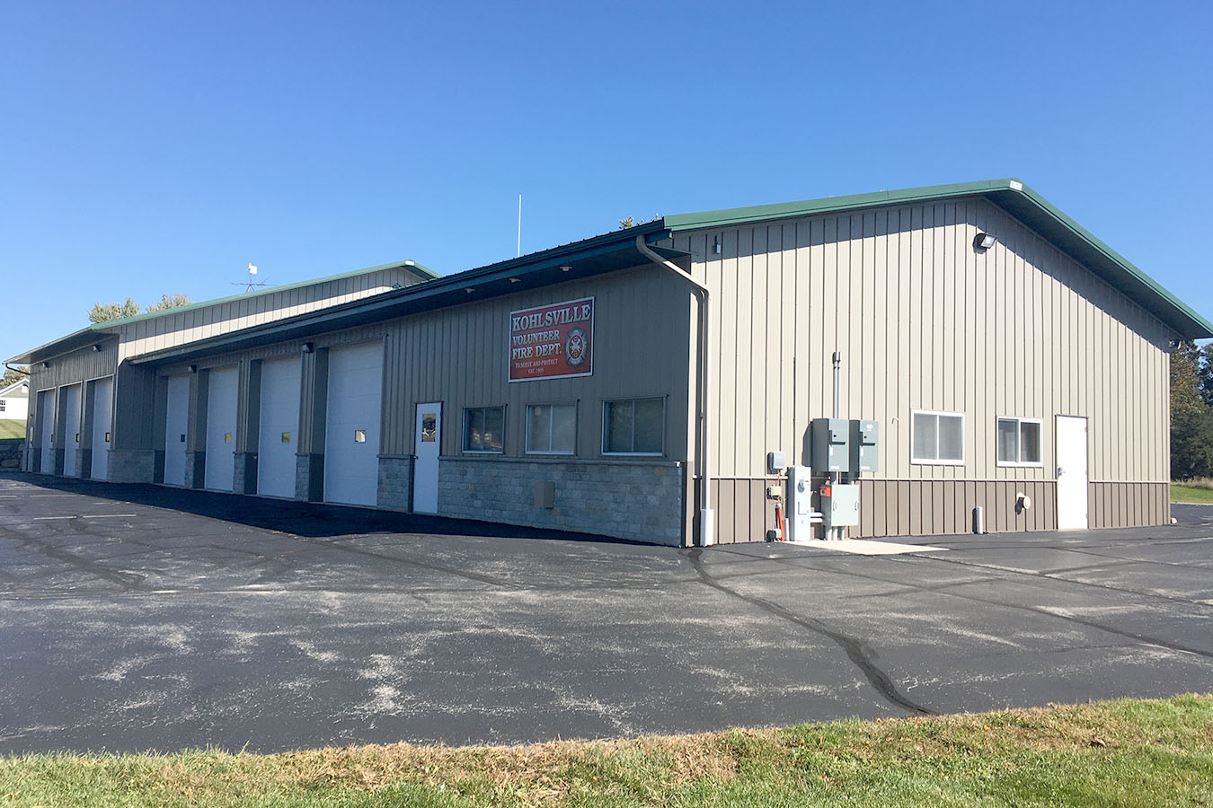 Kohlsville Fire Department fire station with multiple apparatus bay doors and steel siding