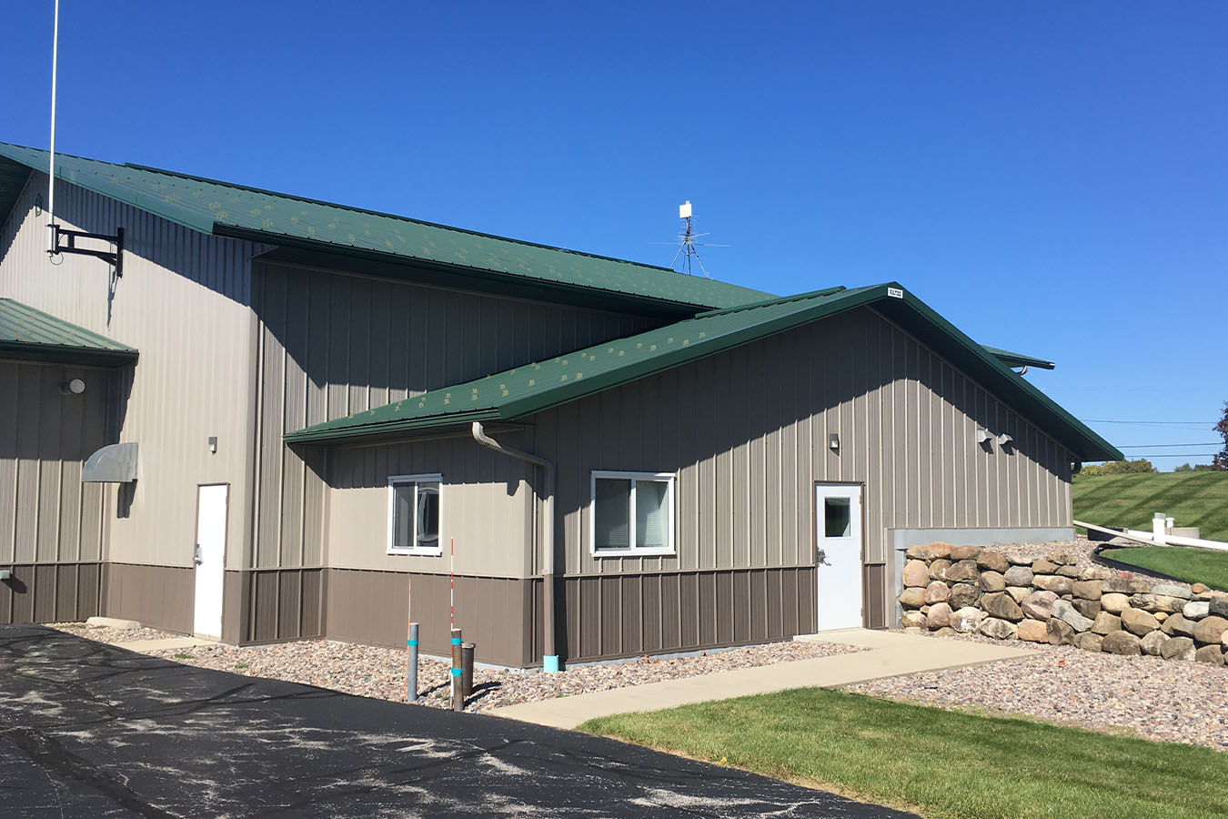 Kohlsville Fire Department post frame fire station side entrance with green metal roof