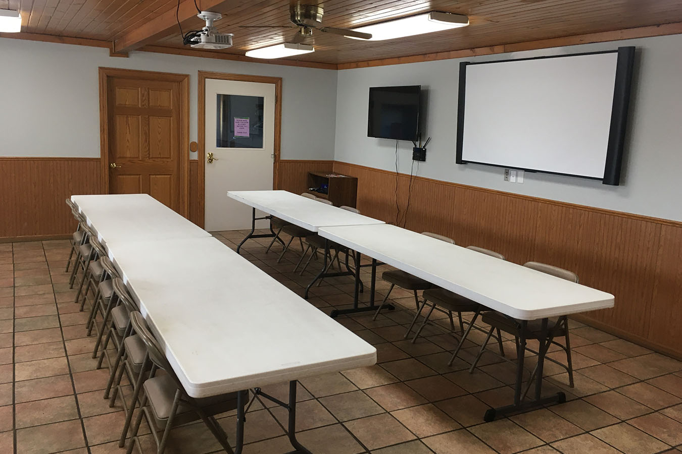 Kohlsville Fire Department training and meeting room with tables and presentation screen