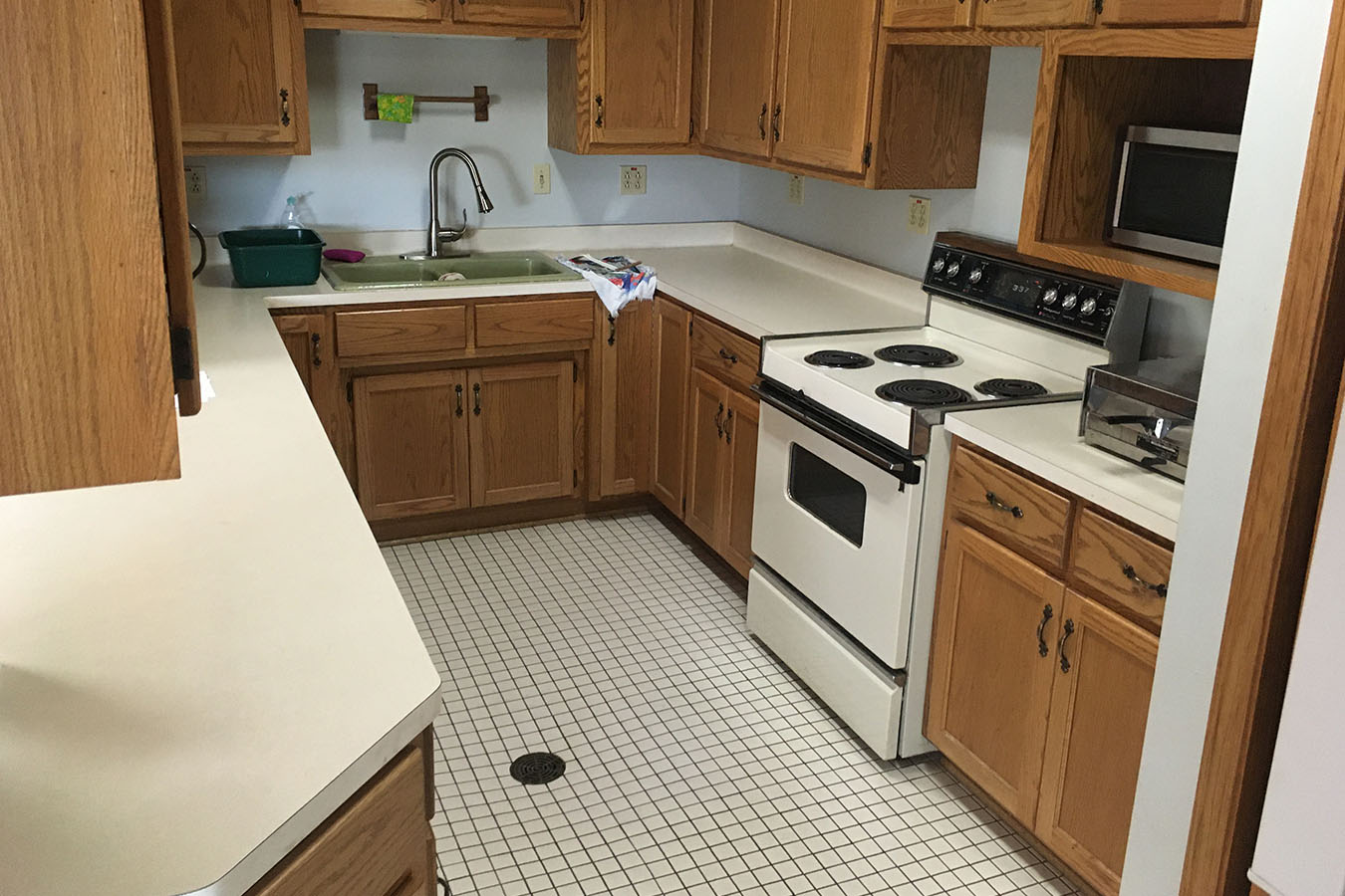 Kohlsville Fire Department fire station kitchen with cabinets, sink, and stove
