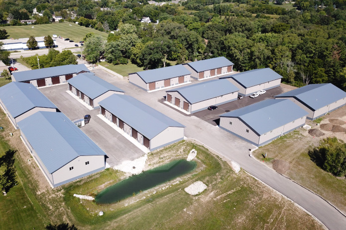 Storage Condo Units with Overhead Doors | Walters Buildings row of storage condo units with garage doors and paved access